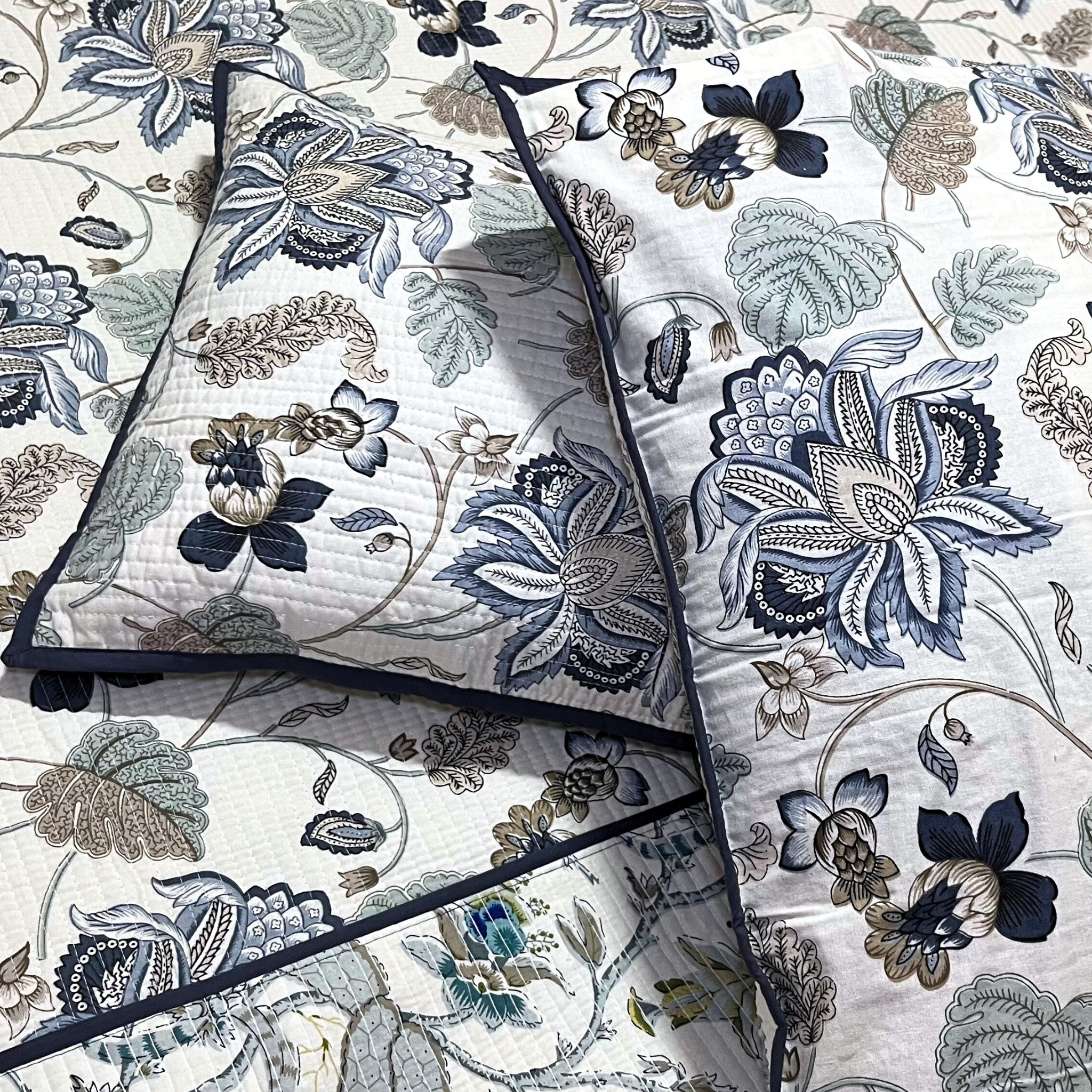 Cozy and stylish RadheKisna Floral Reversible Quilted Bed Cover, with two pillow covers,  made in India.